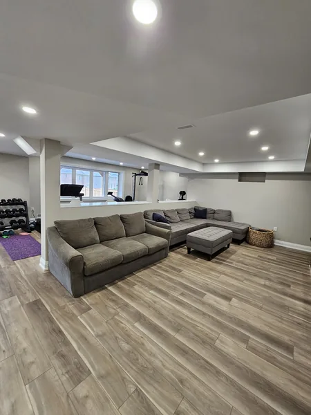 A finished basement in East Gwillimbury: the open plan from the gym to the family room
