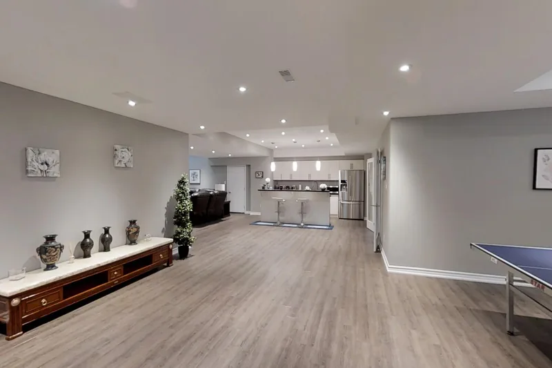 Finished basement in Vaughan: long open-plan room with a games area, in the 3D tour